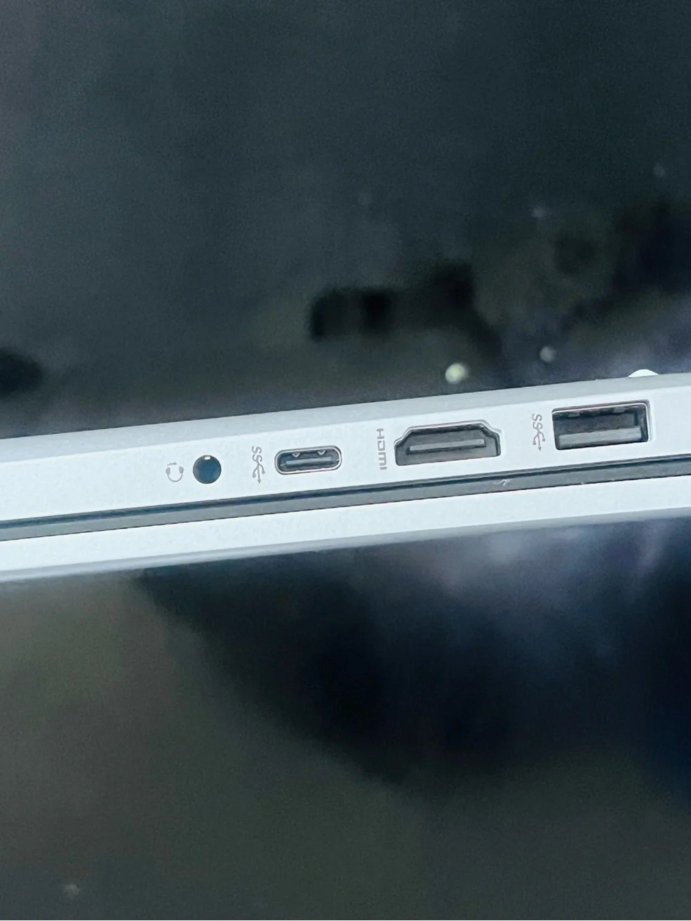 HP Silver Laptop with Blue Display and Dark Gray Keycaps